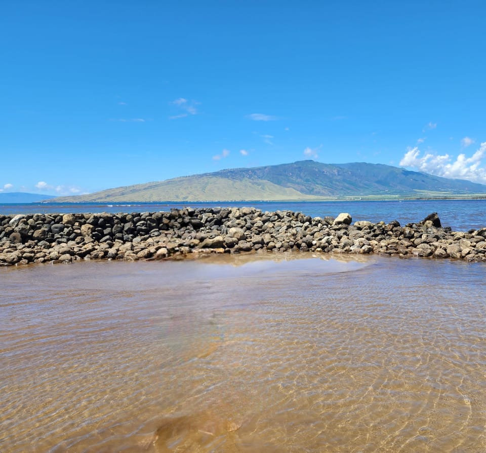 Beach across the street protected from waves by see wall