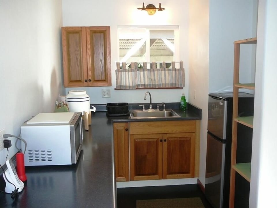 Kitchenette in the Ohana with refrigerator, microwave, toaster and coffee maker.
