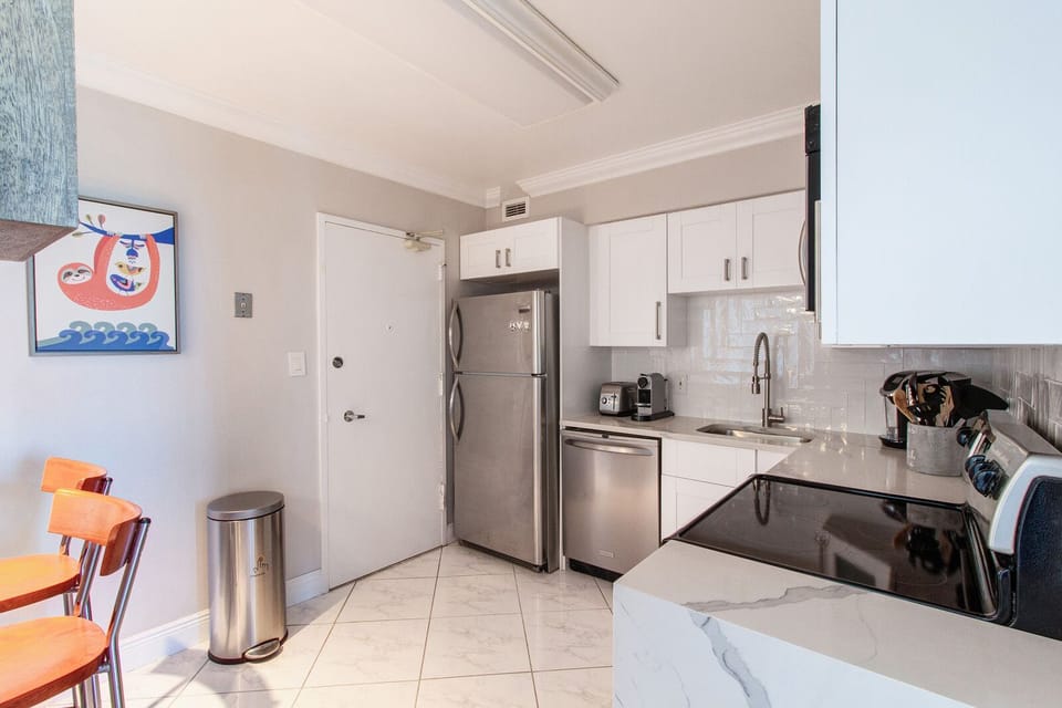 Alternate view of the kitchen. Service Door to the hallway.
