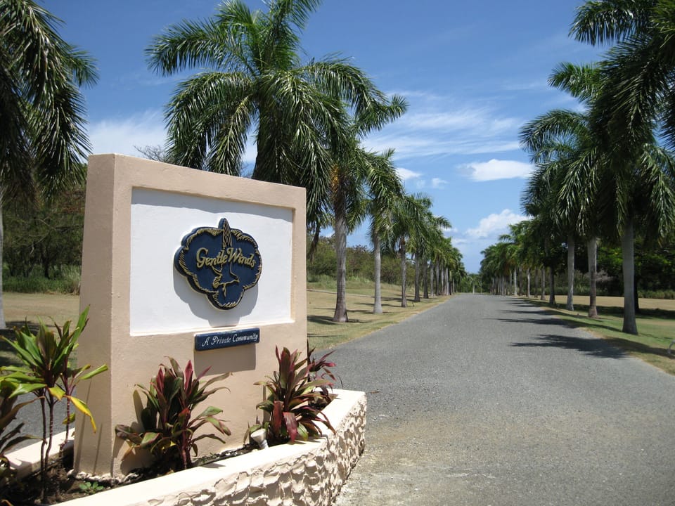 Palm-lined entrance to the secluded private community of Gentle Winds