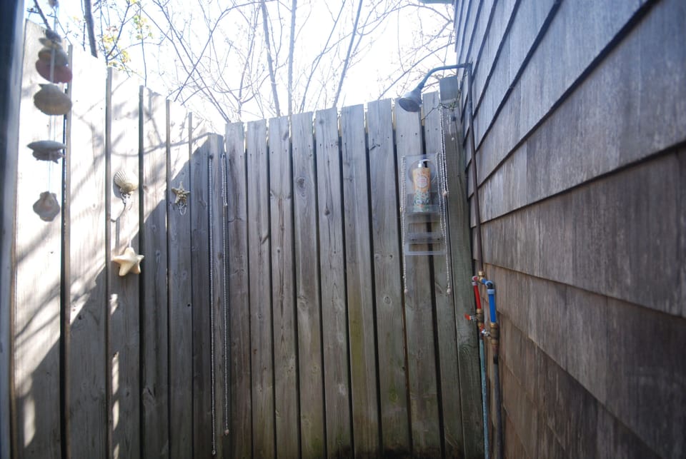Enjoy the exhilaration and freedom of a private, outdoor shower with roses