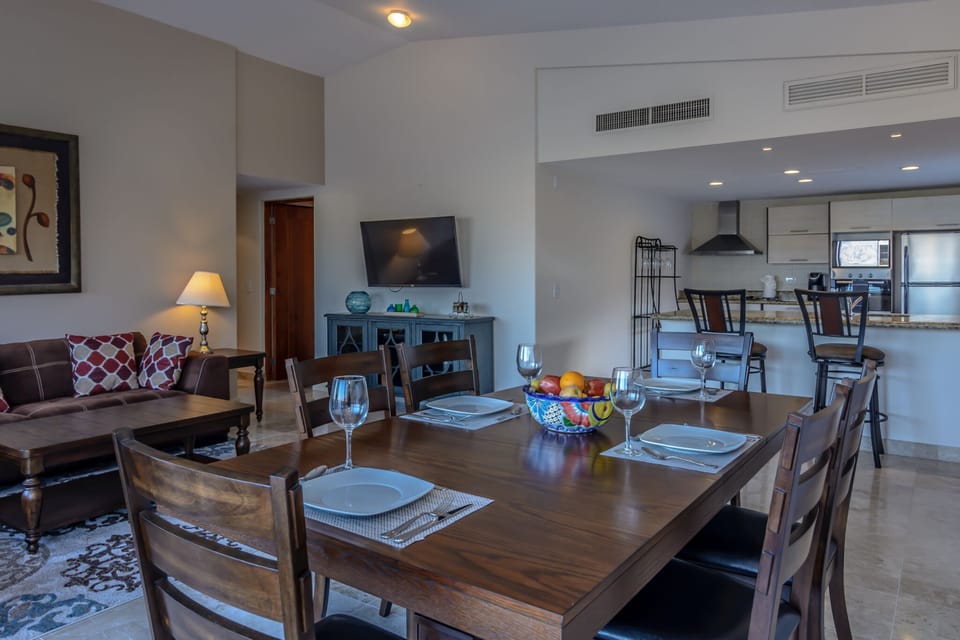 Inside of Casa Denice- kitchen, living room with Smart TV, and dining room!