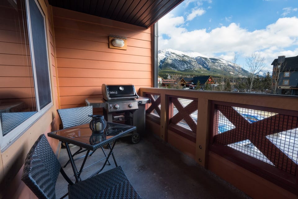 Outdoor balcony with Mount Lady MacDonald. Weber 2 burner gas BBQ. Enjoy!
