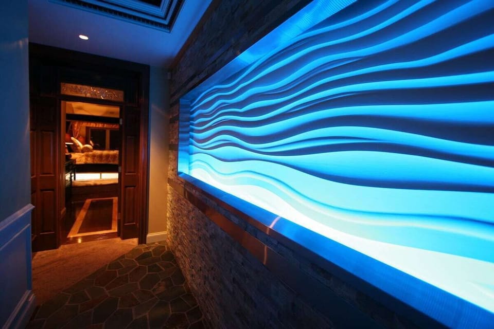 This 16' Snowdrift Wall Sculpture Changes Colors Throughout The Day