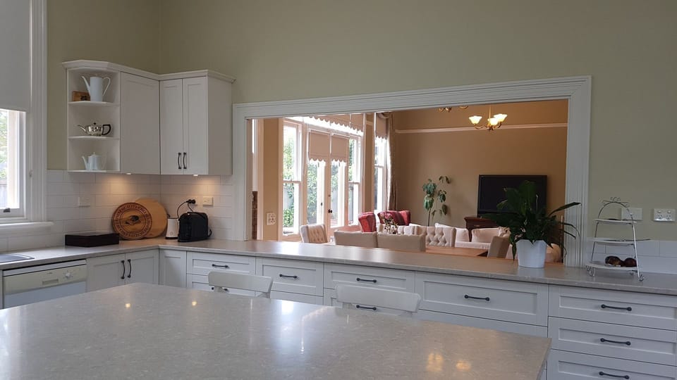 Kitchen view through servery to lounge and dining
