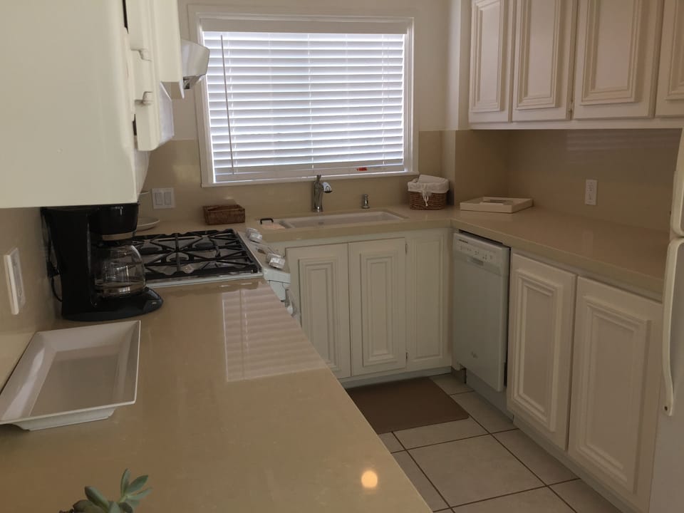 Kitchen includes dishwasher, gas range, refrigerator