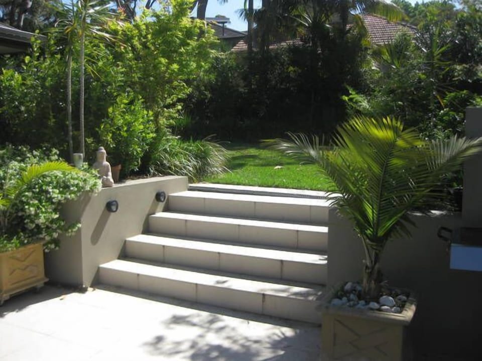Stairs to backyard lawn area