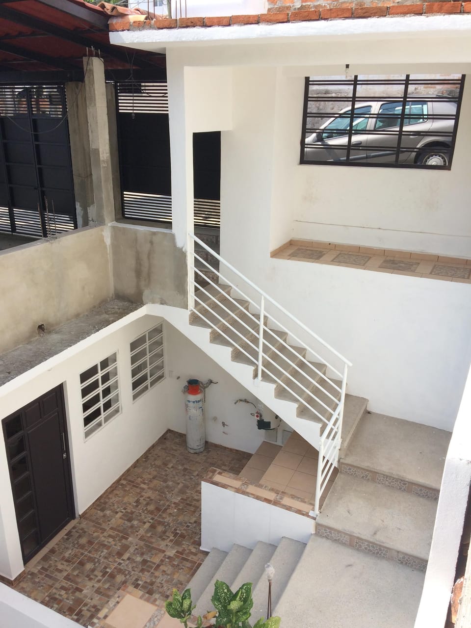Entrance from street level on the inside. 1 Br Condo is one level below.