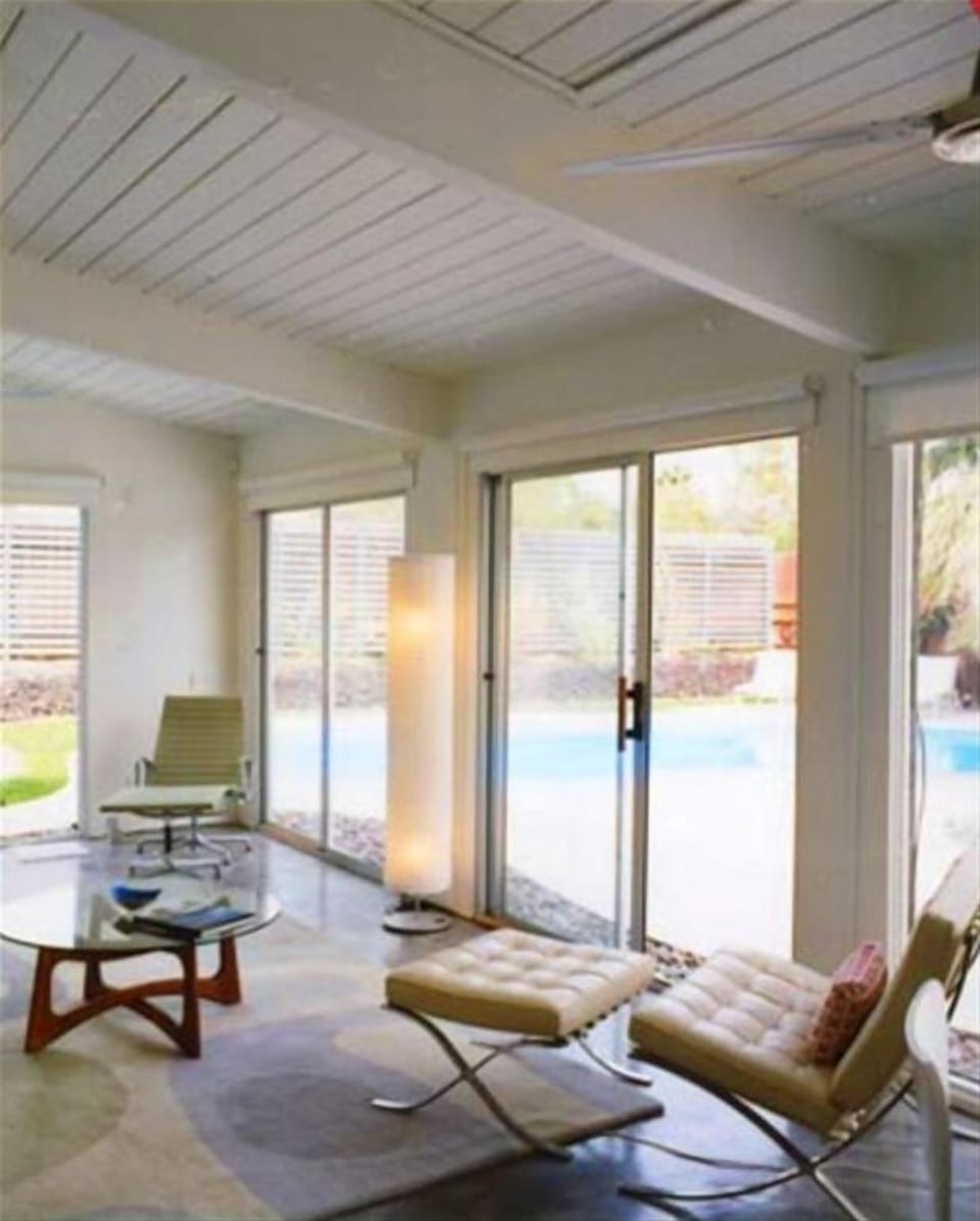 The main room, with wall-to-wall glass and sliders