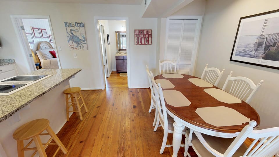 Dining area seats 6 and kitchen bar-top seats three
