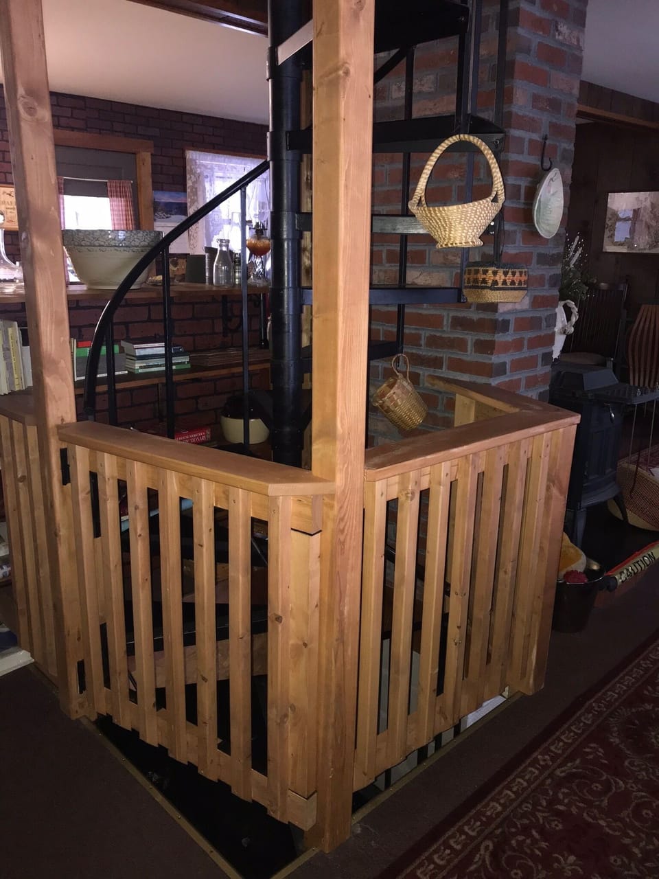 Stairwell and children’s gate around it on main floor