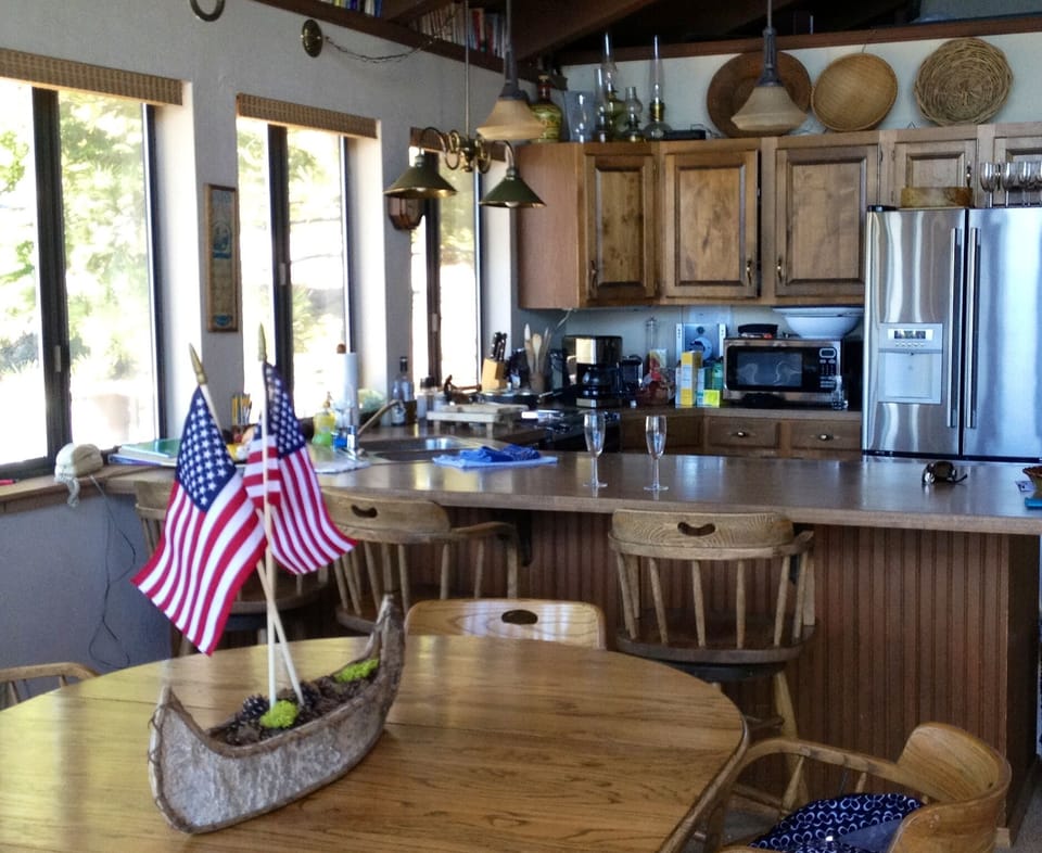 Another shot of the dining and kitchen area with lovely views