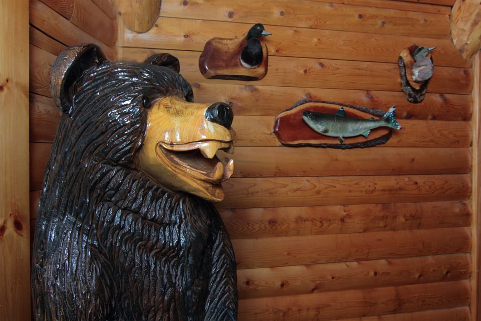 Meet our 7' hand carved bear..lots of taxidermy and cabin-y decor throughout