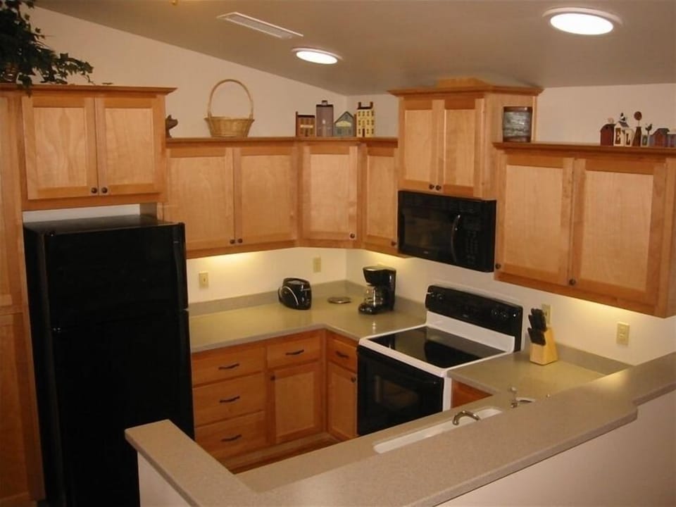 Well supplied with pots/pans in the full amenity kitchen lit by solar tubes