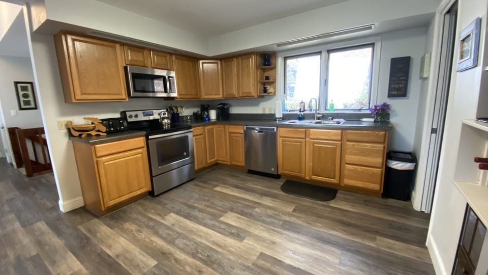 Kitchen with all new appliances, refrigerator with ice dispenser and water disp 