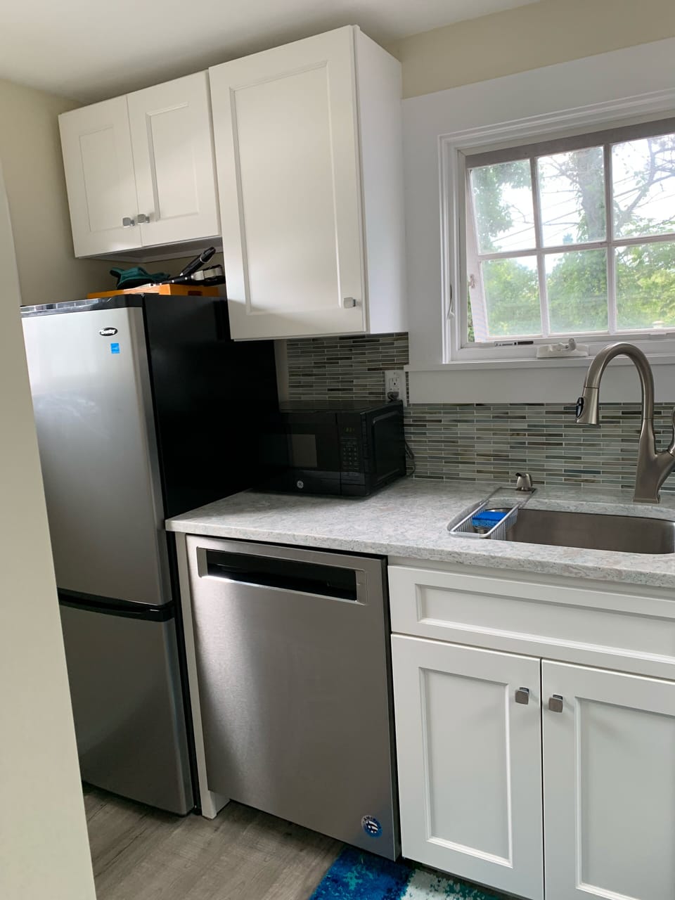 New kitchen, dishwasher, refrigerator, counter top and back splash ,July 2019