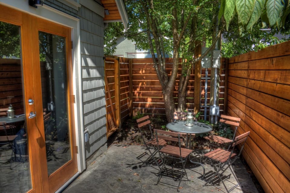 Coach House private patio and double french doors to living area