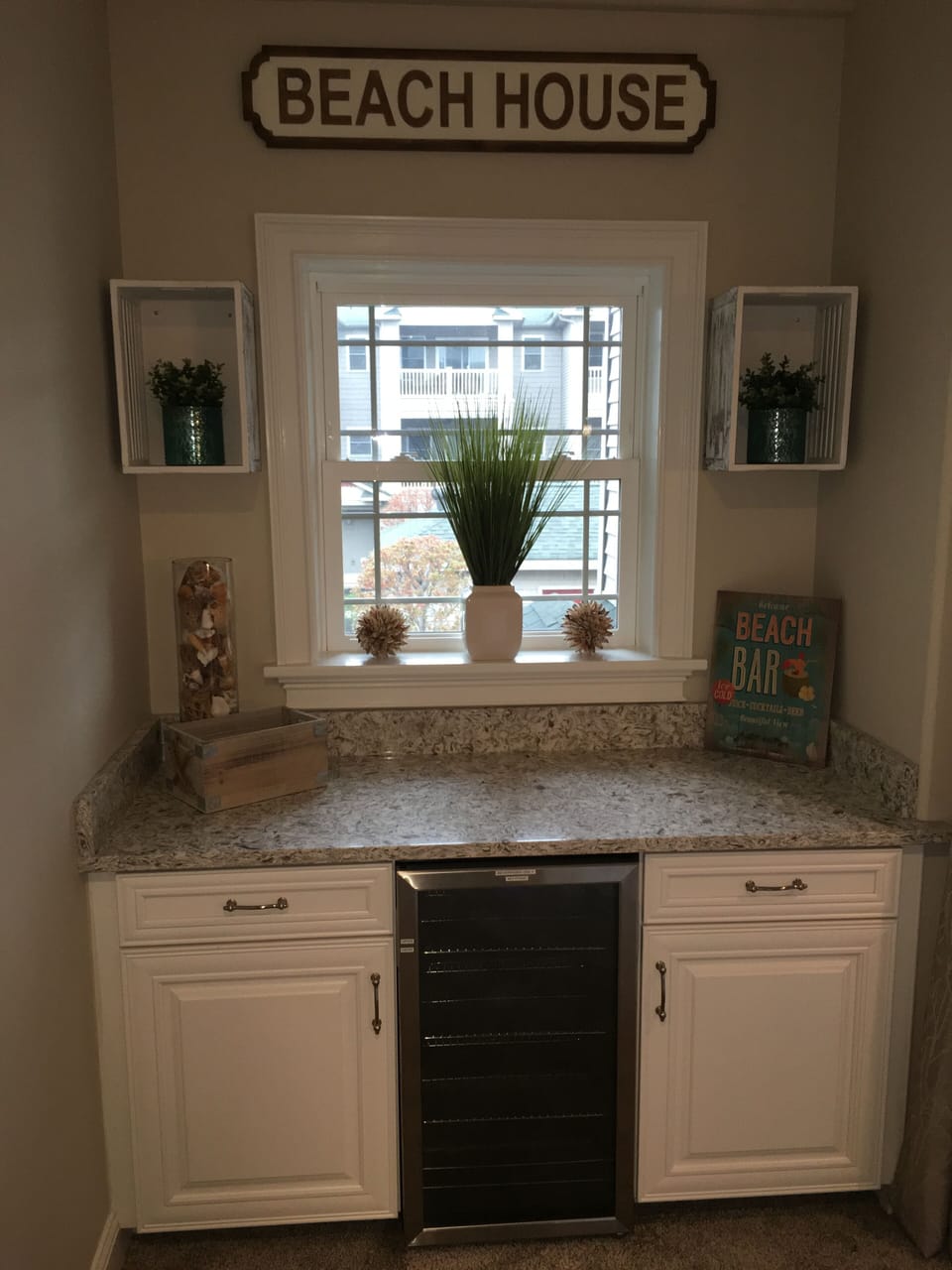 Beverage bar center.  Fridge to hold extra beverages cold along with storage
