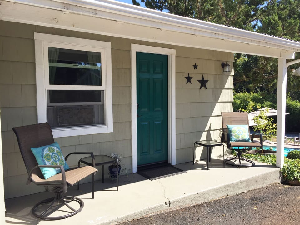Cottage front porch.  Door leads to front cottage queen bedroom.