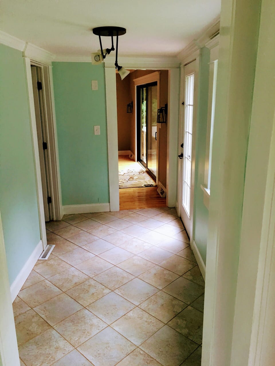 Mudroom that leads out to the pool area and custom bathroom indoors