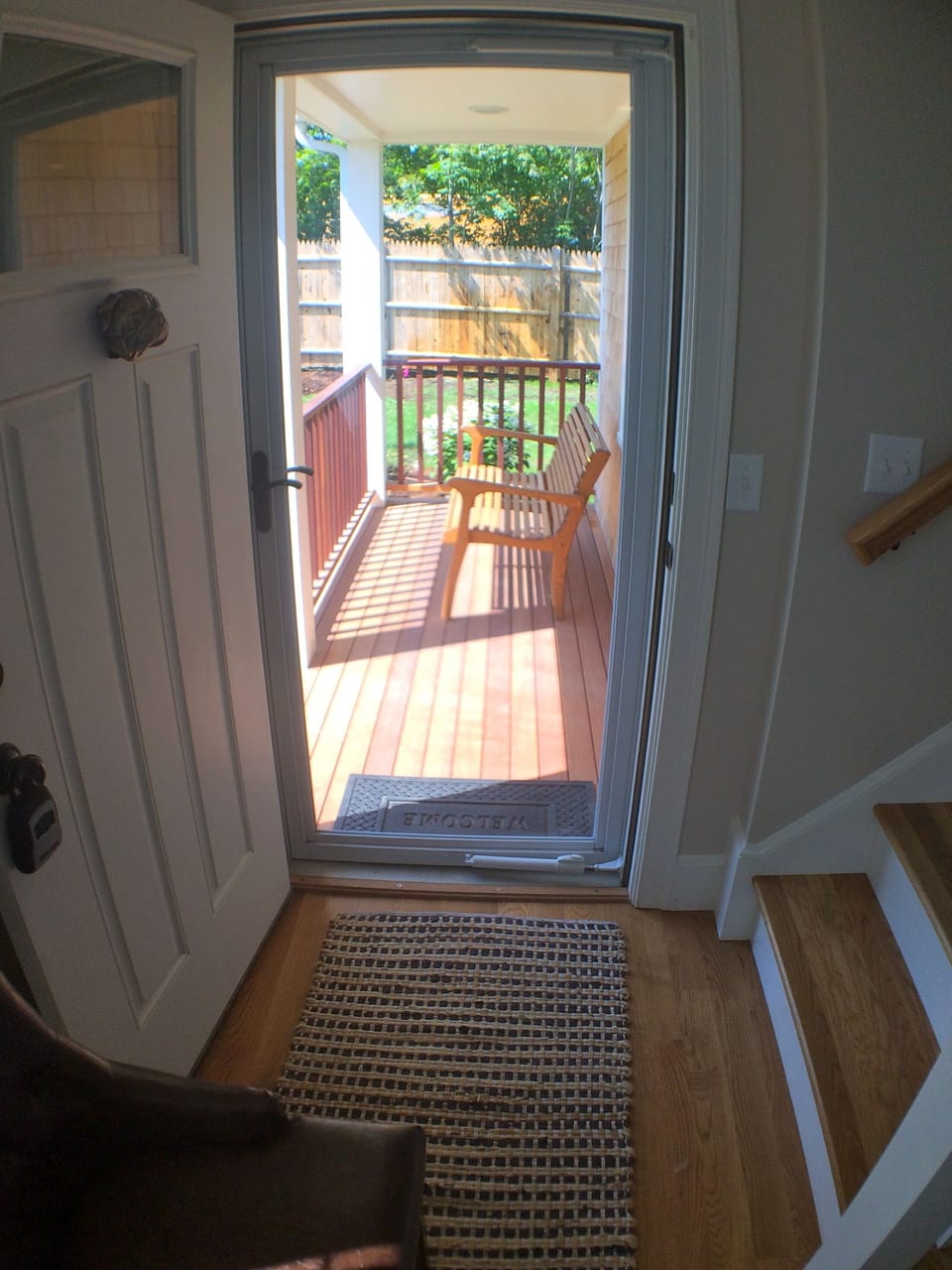 Front entrance at the end of the flagstone path and front deck with bench seat