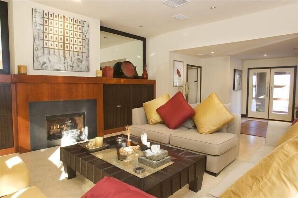great room with custom cabinetry, art, sculpture