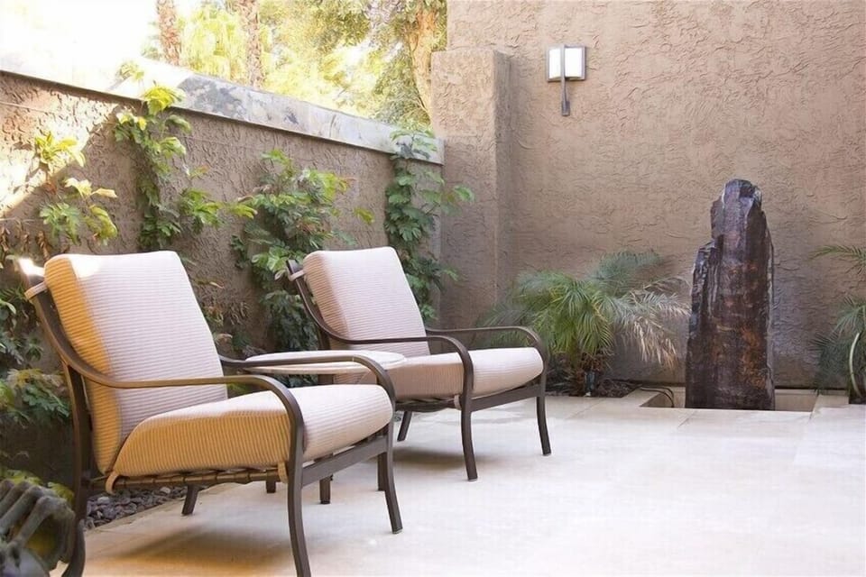 private travertine entry courtyard with fountain