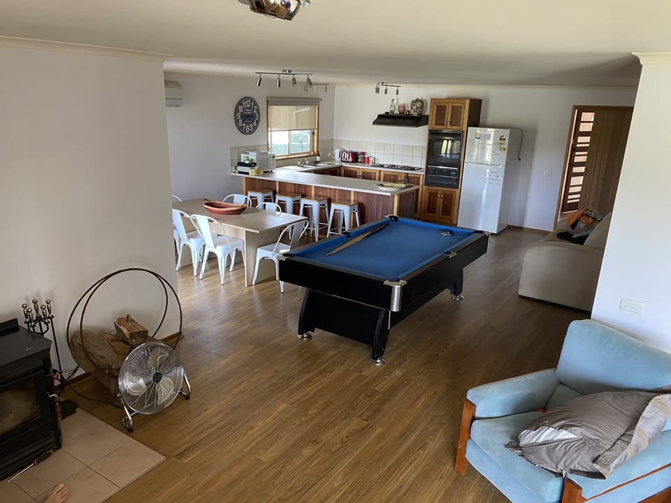 Kitchen, dining, pool table off living room