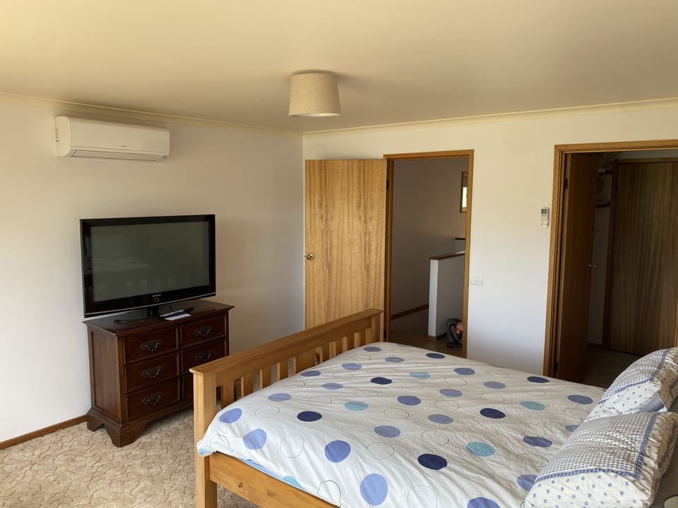 Bedroom 1 queen bed,  tv with chromecast, split system
