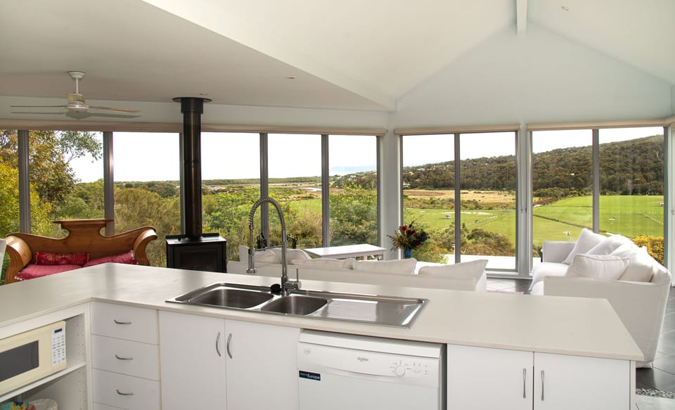 From new large kitchen to potbelly stove and living area upstairs.