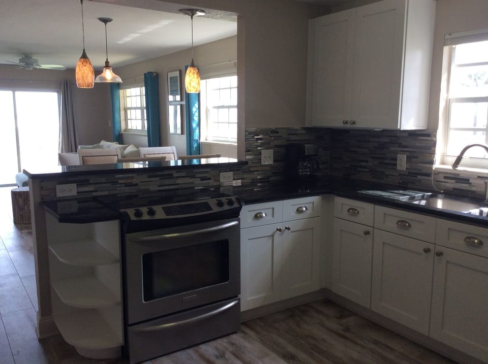 Modern kitchen with granite countertops and stainless steel 
