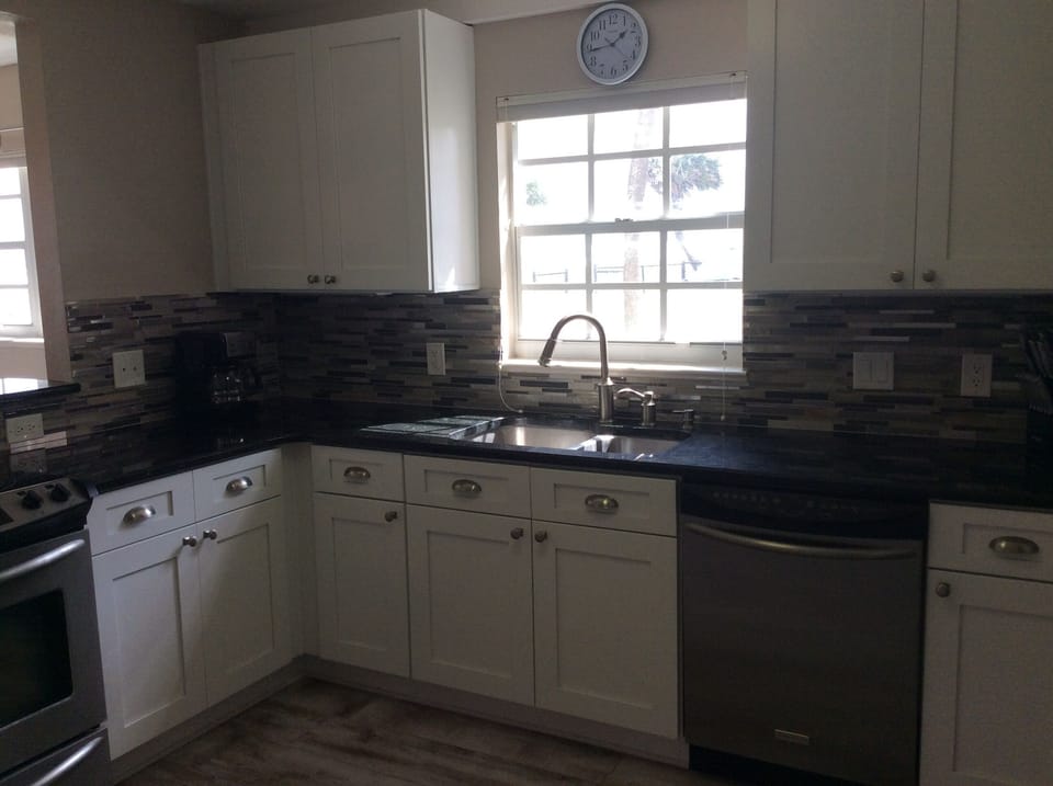 Modern kitchen with granite countertops and stainless steel appliances
