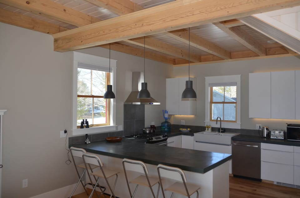 The spacious and well-equipped kitchen includes a deep peninsular for breakfasts