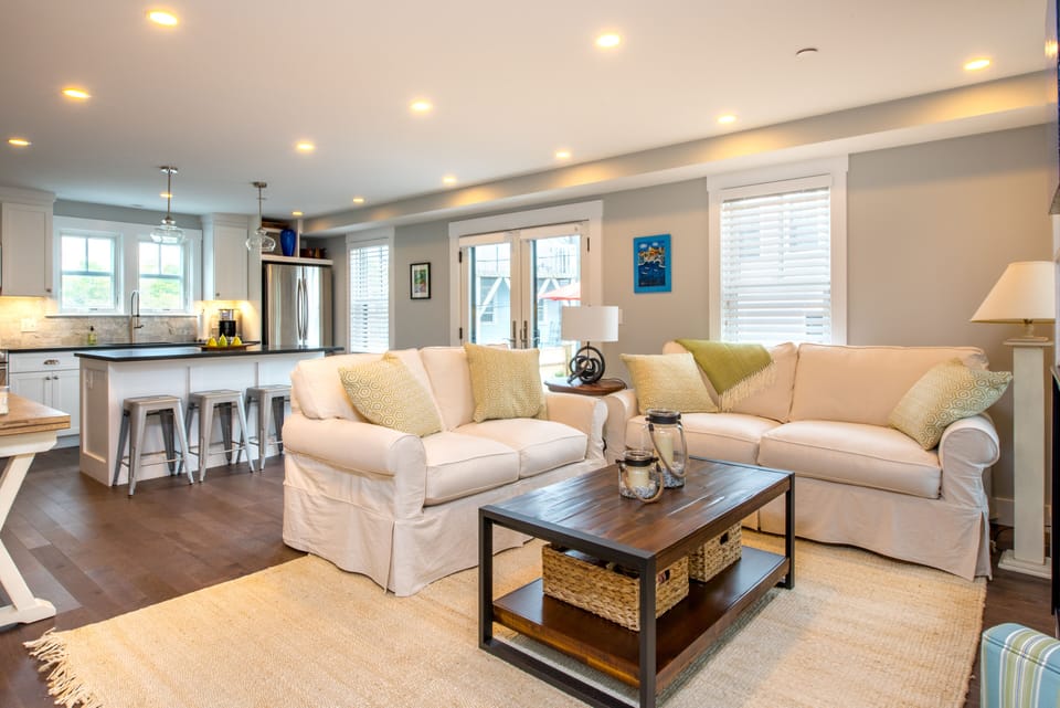 Comfy down seating in open living space invite you to nestle in with a good book