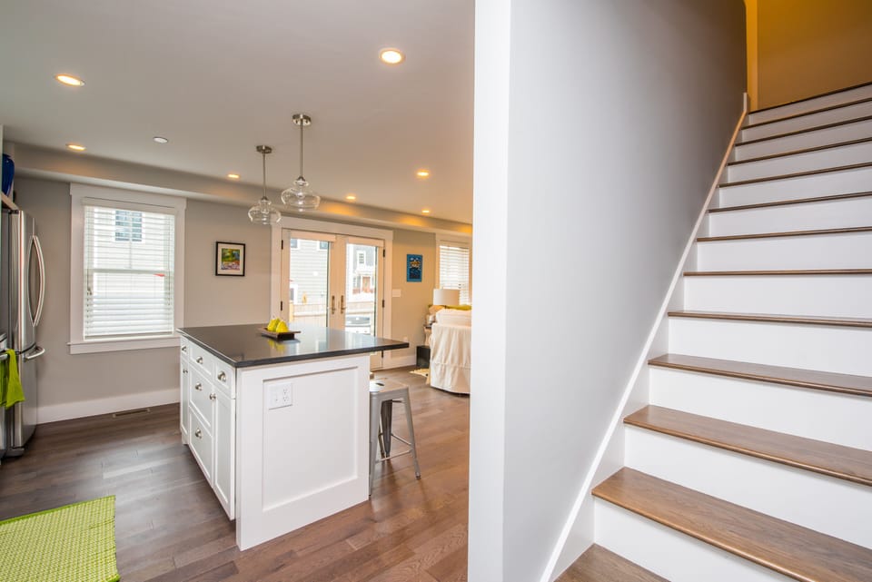 From kitchen & living area, looking upstairs to the bathrooms and bedrooms.