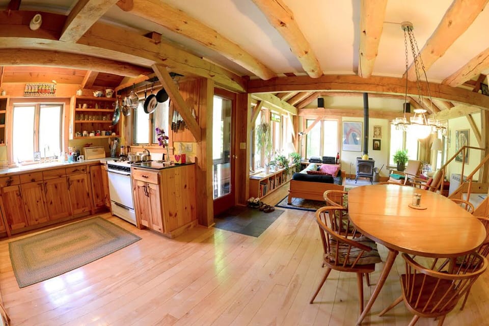 View of Kitchen/Dining Rooms and Living Room in background.  Photo by John Finn.
