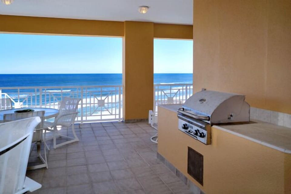 Large wrap around balcony with custom built-in grill.