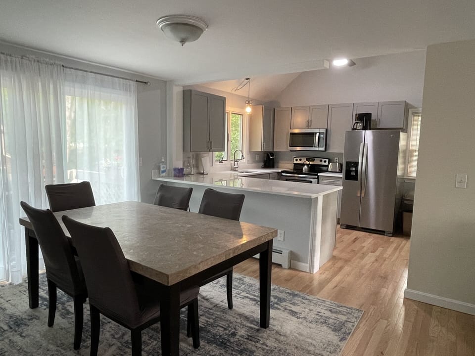 Open dining room, living room, kitchen (brand new) 
 & deck.
