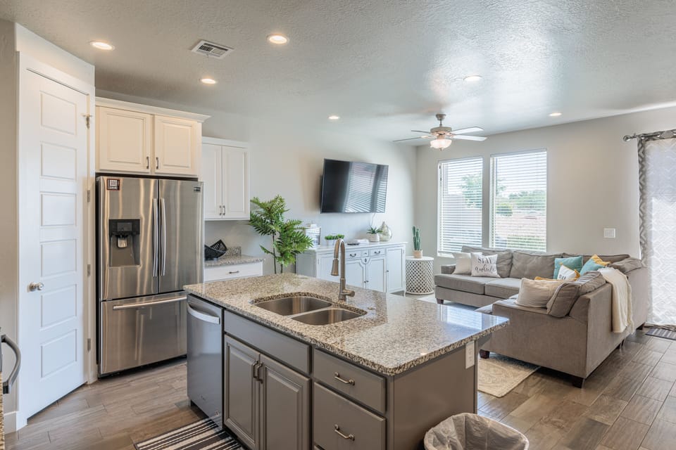 Kitchen View - The kitchen includes a spacious island with plenty of counterspace for meal preparations.