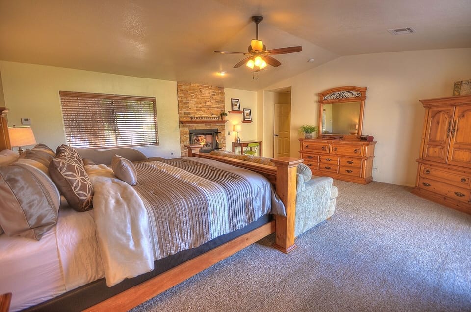 Large master with a king bed