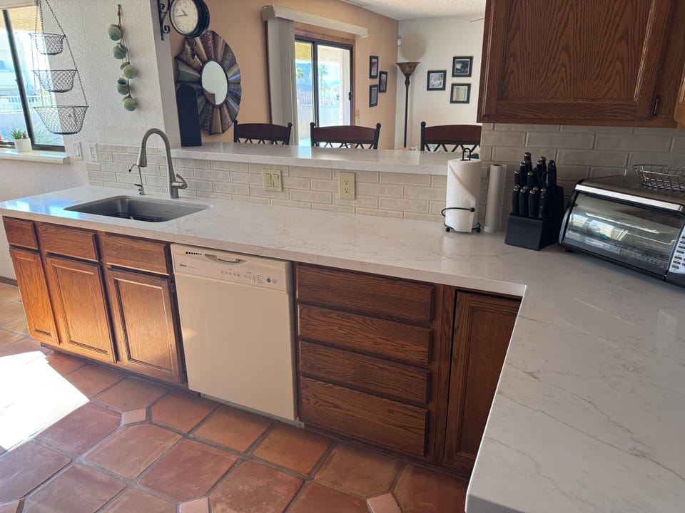New Quartz countertops and tile backsplash