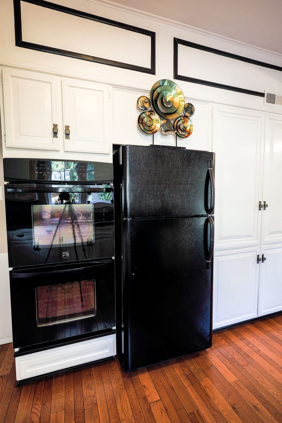 Kitchen with double oven and ample counter space.