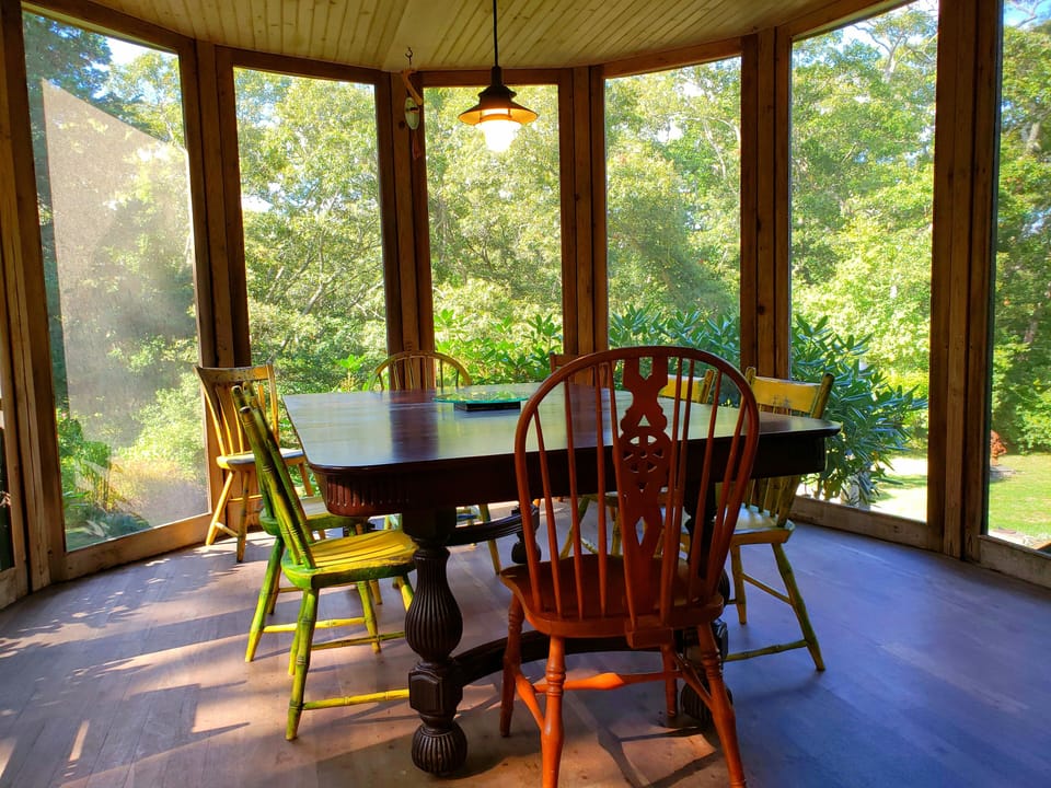 Enter to this screened porch from kitchen ,front and back wrap around decks