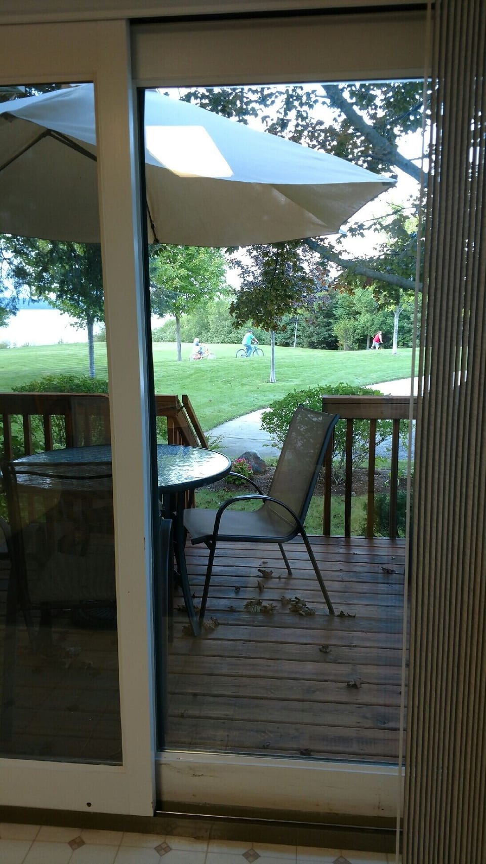 View of bicyclists on trail from Kitchen.