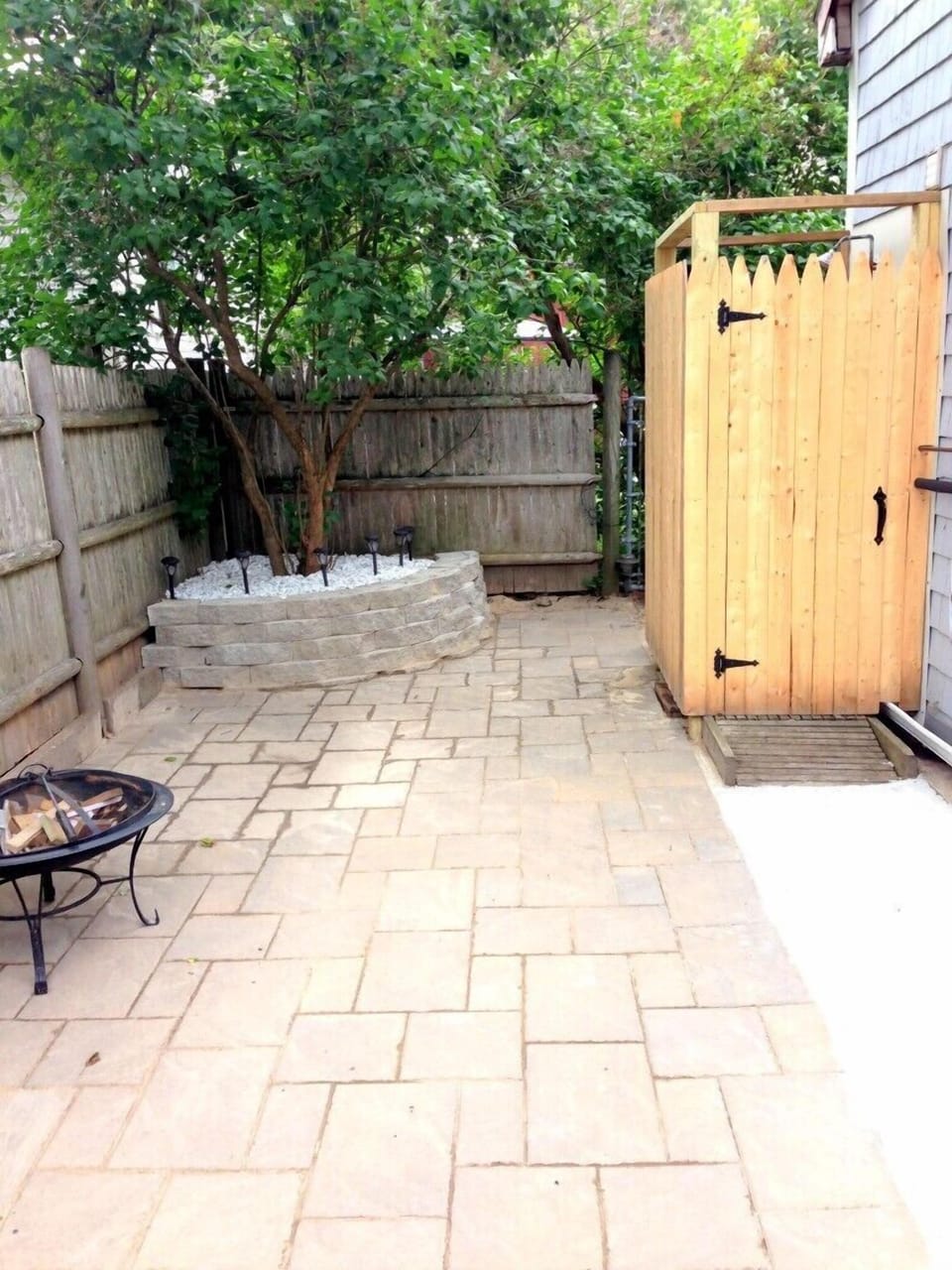 Back Patio – brand new beautiful pavers. The fence and outdoor shower floor have been power washed since.  This is a great private area, secluded from neighbors, to grill and hang out after the beach or when the sun goes down.