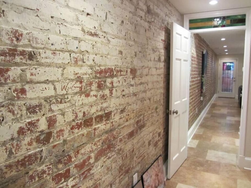 Exposed Brick and seasonally heated travertine floors