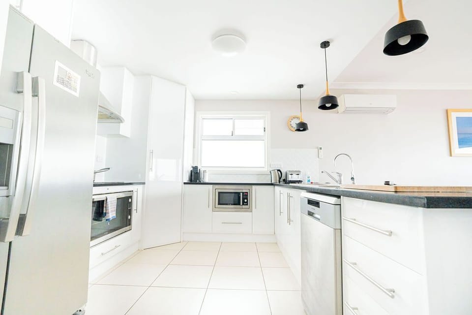 upstairs kitchen, under bench microwave, dishwasher, pod coffee machine,