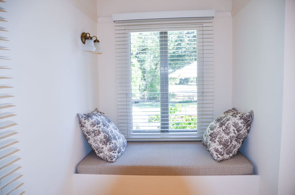 Window seat with beautiful lawn, vineyard and valley views. Photo by Carol Troy.