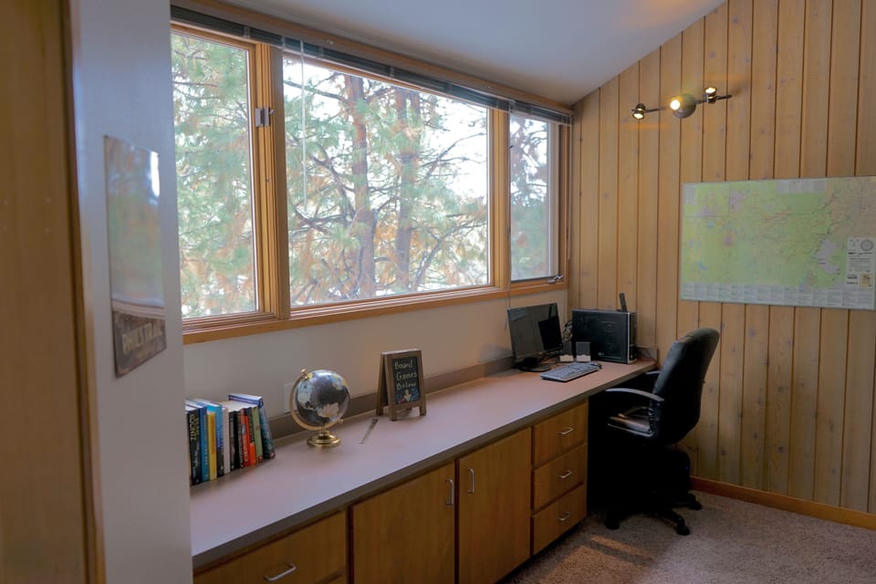 Loft area features computer work station available to guests