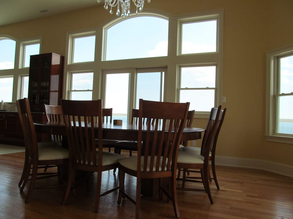 Dining table for 10 with breathtaking view and gorgeous chandelier on top.